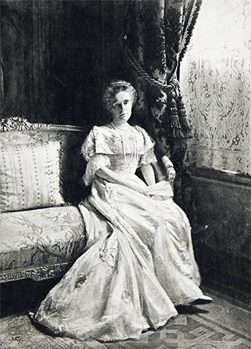 Photo by Curtis Bell of Elisabeth Mills Reid in her New York City home. Town and Country, May 19, 1906, p. 19.