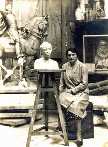 Angela Gregory and her sculpture, "La Belle Augustine," 1928. Tulane University
