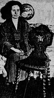 Photograph of Leonora Raines together with James McNeil Whistler's chair, which she donated to the High Museum in Atlanta. The Atlanta Journal, May 2, 1932, p. 21