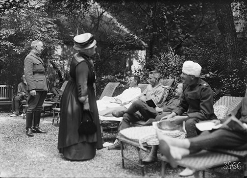 Elisabeth Mills Reid and Colonel Gibson visiting convalescing officers at 4 rue de Chevreuse, 1918. Photographer: Lewis Wikes Hine. American National Red Cross Photograph Collection, Library of Congress, no. 17160