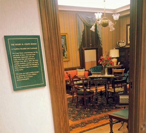 A photo from 2016 peering into University of Michigan-Flint’s Crapo room in the Thompson Library. The corner of Letta’s painting “Taormina” is just visible (photo from Thompson Library blog)