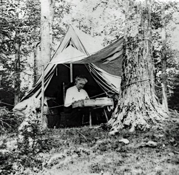 Elizabeth Taylor, living in her tent, "Tent City," on the Hubbard Farm in 1912, during her first visit to Rochester, Vermont