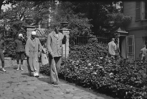 American officers walking in courtyard, the man in lead is blind (August, 1918), American National Red Cross Photograph Collection