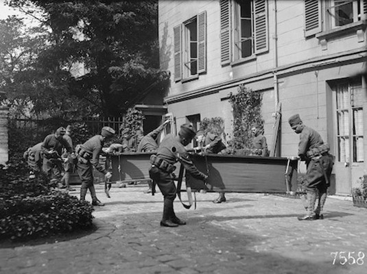 Corps-men having "litter drill" in the courtyard (September 1918), American National Red Cross Photograph Collection. Library of Congress