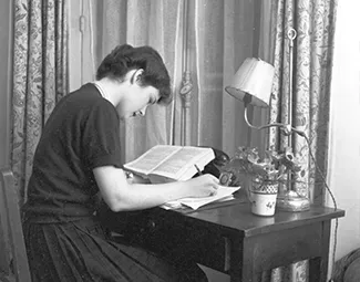 Resident in her bedroom, 1950s. Photograph retrieved from U.S. National Archives & DVIDs.