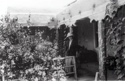 Mary Greene Blumenschein in front of her Taos home. d'Emilio, p. 158