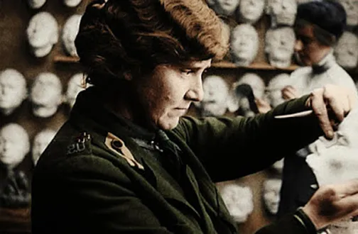 Anna Ladd putting finishing touches on a plaster mask; Jeanne Poupelet in the background