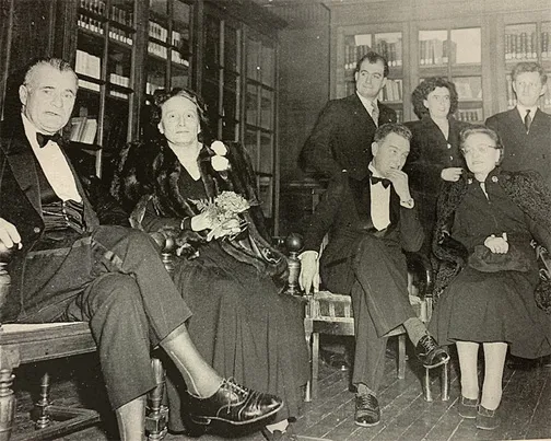 Reid Hall's reopening, February 12, 1948. The seated dignitaries in the library are (from left): U.S. Ambassador to France Jefferson Caffery; Miss Dorothy Leet; French Director General of Cultural Relations in the Foreign Affairs Ministry Louis Joxe; Smith College Junior Year Abroad Director Miss Madeleine Guilleton. Associated Press.
