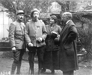 Saying "Good-bye" - Madame Ladd, blind mutilé and his comrade. Photograph. Retrieved from the Library of Congress, <www.loc.gov/item/2007676084/>.