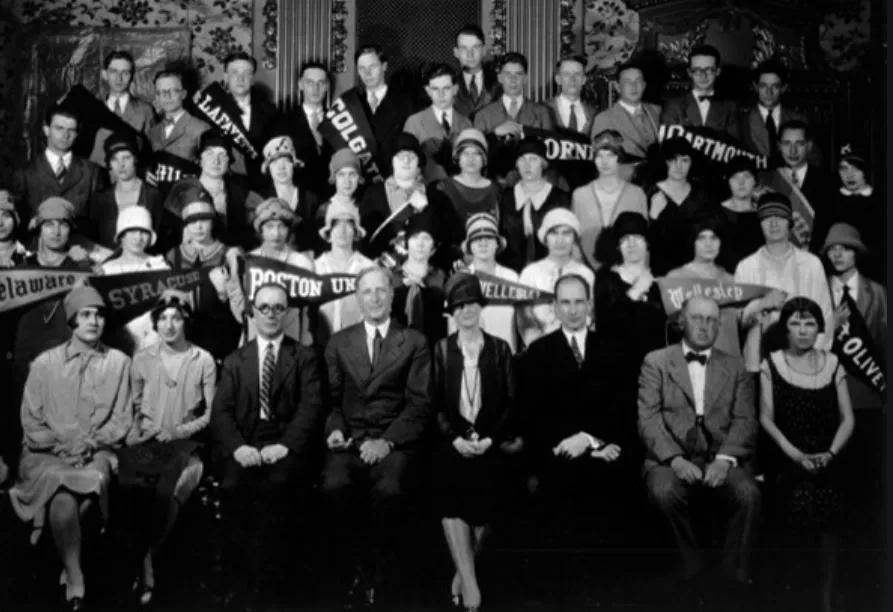 Students from a range of American colleges and universities studying abroad through Delaware's Junior Year Abroad Program, ca. 1920s. Professor Kirkbride and President Hullihen are seated in the front row, third and fourth from left respectively. (University of Delaware Special Collections)